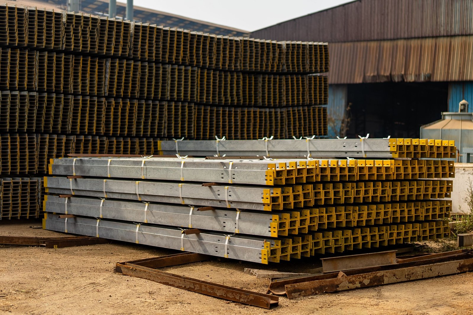 Construction materials stacked in an industrial storage yard