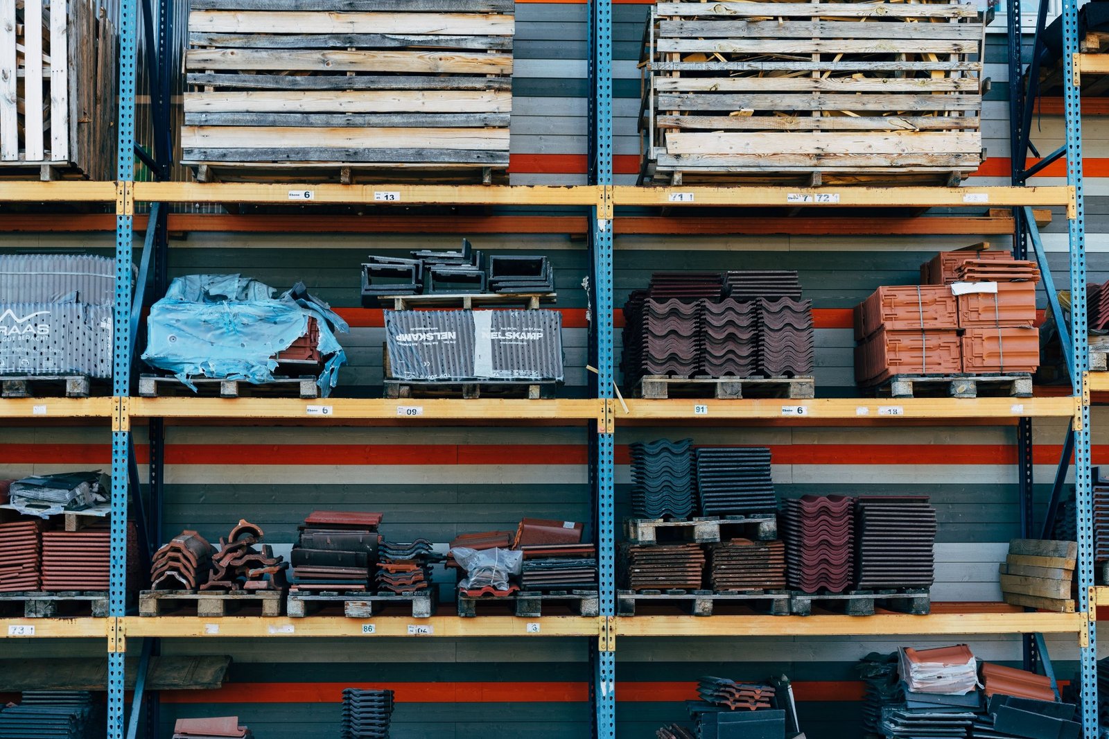 Construction materials and roof tiles stored on warehouse racks