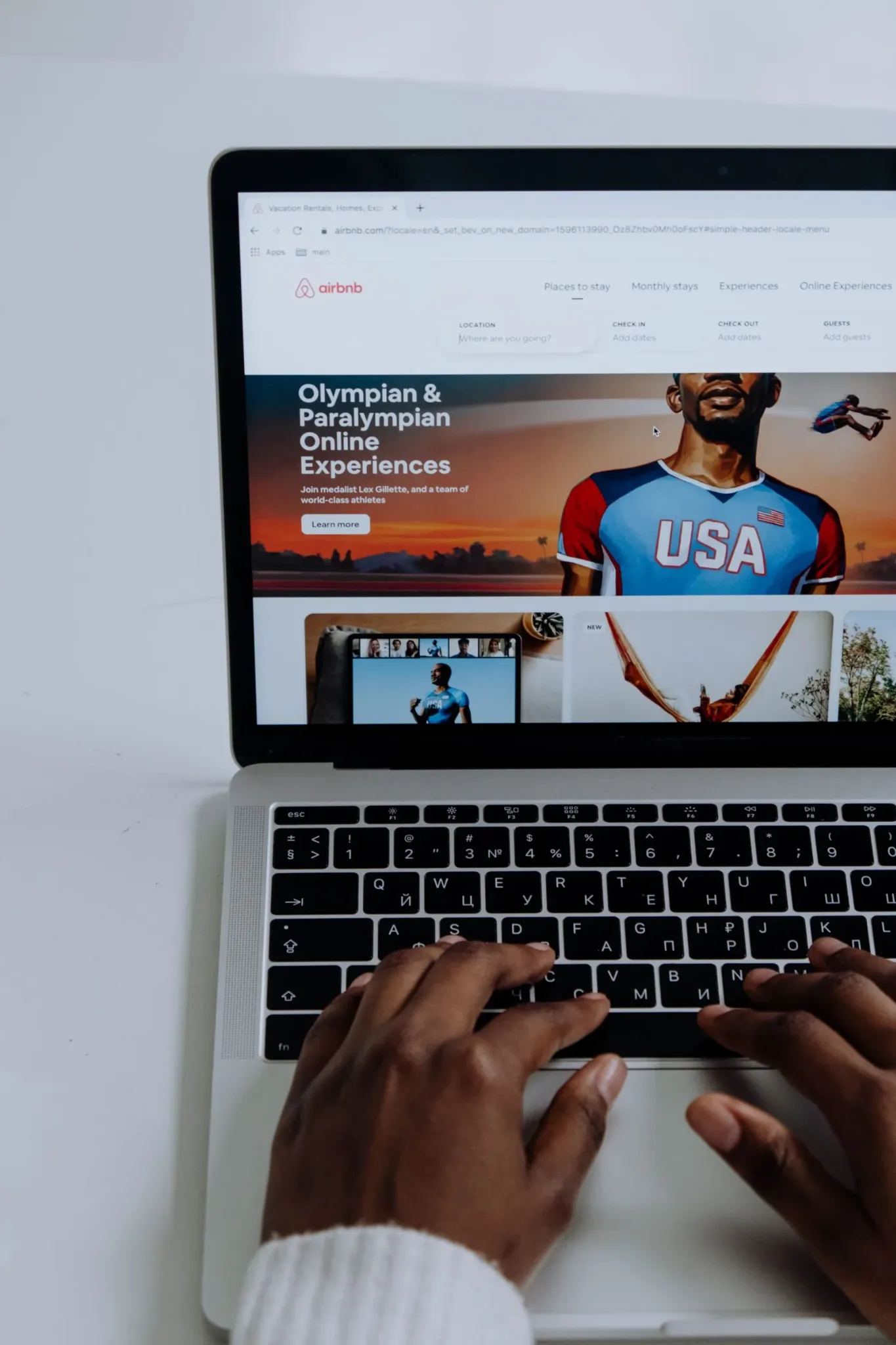 Hands using a laptop to plan a connected small-business marketing system