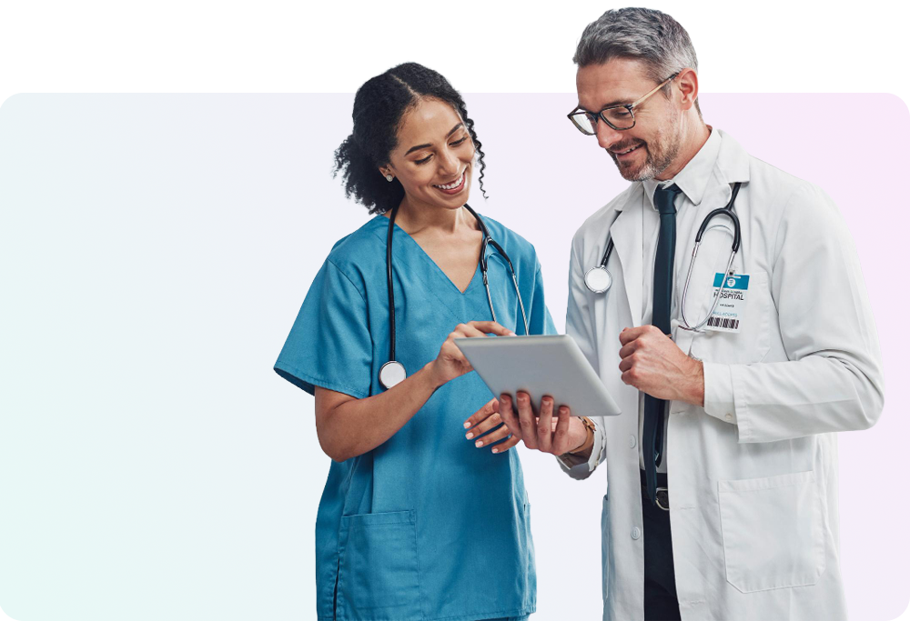 Healthcare clinicians reviewing information together on a tablet