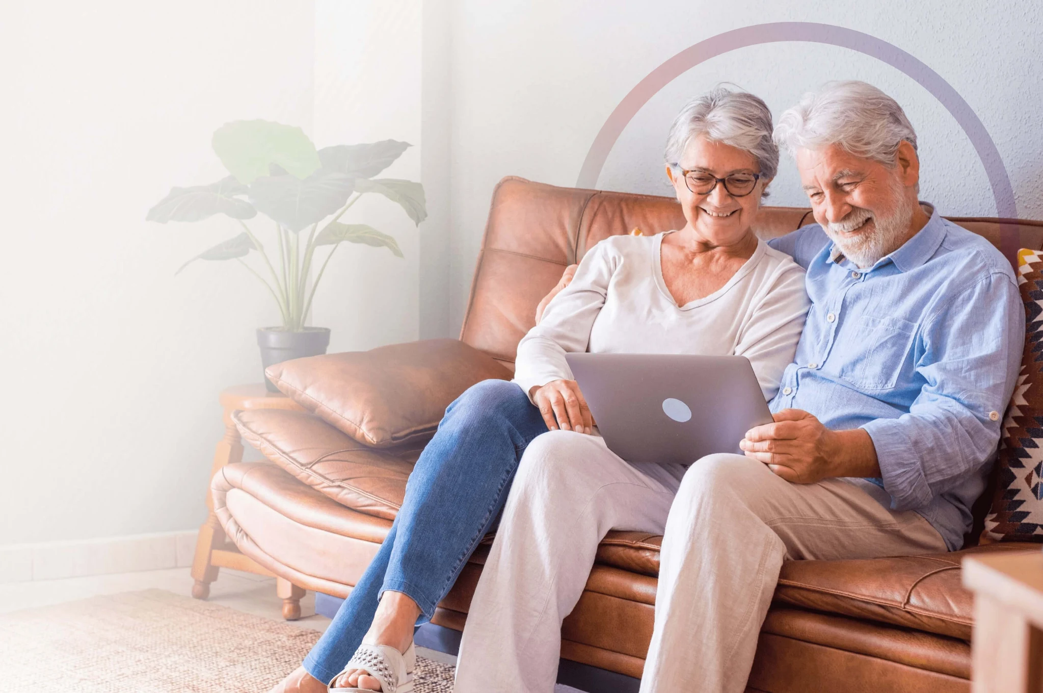 Older adults using a laptop together as a visual for virtual healthcare access
