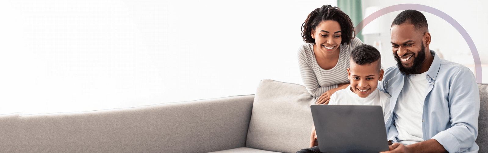 Family using a laptop together, illustrative online-care imagery
